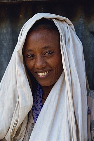 Head and shoulders portrait of woman, smiling and looking at the camera, Ethiopia, Africa