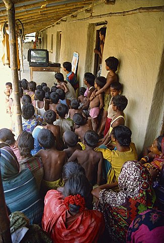 Group of people watching health video, Bangladesh, Asia