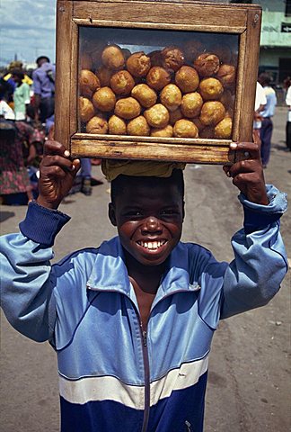 Boy selling bean cakes, Monrovia, Liberia, West Africa, Africa