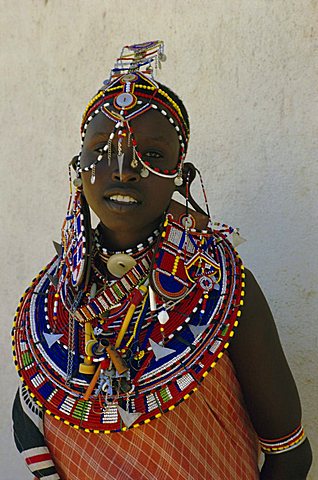 Portrait of a young Masai woman in traditional dress and jewellery, northern Kenya, Kenya, East Africa, Africa