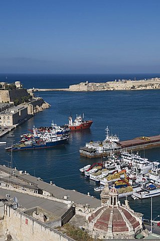 View of the Grand Harbour with fishing boats taken from Barracca Gardens, Valletta, Malta, Mediterranean, Europe