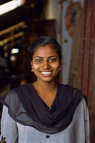 Portrait of a shop assistant inantique area of Jewtown, Fort Cochin, Kerala state, India, Asia