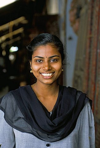 Shop assistant in the antique area of Jewtown, Fort Cochin, Kerala, India, Asia