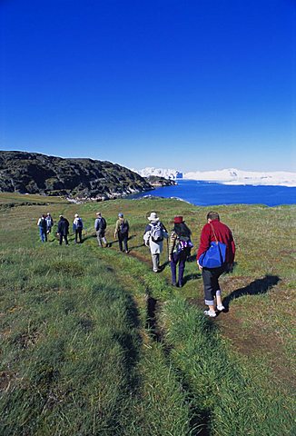 Tourists walking towards the icefjord at Sermermiut, Ilulissat, formerly Jacobshavn, Greenland, Polar Regions