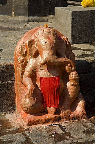 Outdoor Hindu shrine to Ganesh, the elephant god, on the ghats below Ahilya Fort, Maheshwar, Madhya Pradesh state, India, Asia