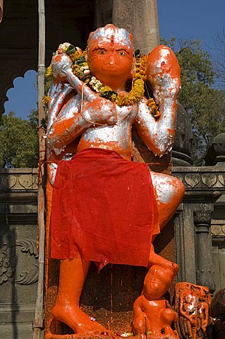 Outdoor Hindu shrine to Hanuman the monkey god, on the ghats below Ahilya Fort, Maheshwar, Madhya Pradesh state, India, Asia