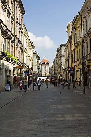 Looking down Florianska street towards Florian's Gate on the old city walls, Krakow (Cracow), UNESCO World Heritage Site, Poland, Europe