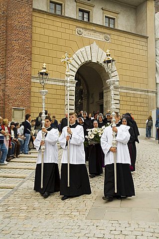 Funeral procession coming through one of the main gates to Wawel Castle and Cathedral, Krakow (Cracow), UNESCO World Heritage Site, Poland, Europe