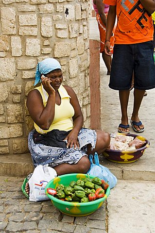 Local selling vegetables and using mobile phone, Espargos, Sal, Cape Verde Islands, Africa