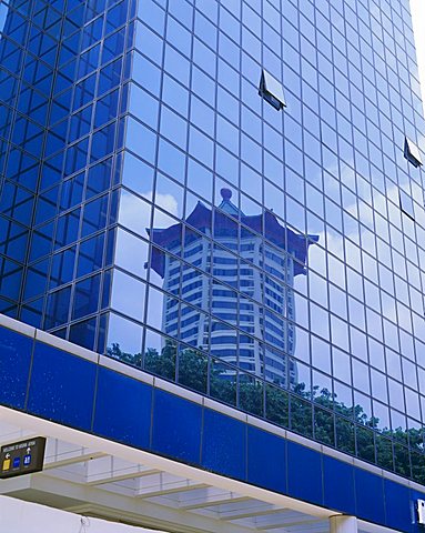 Reflections in a building on Orchard Road, one of the main shopping areas of Singapore