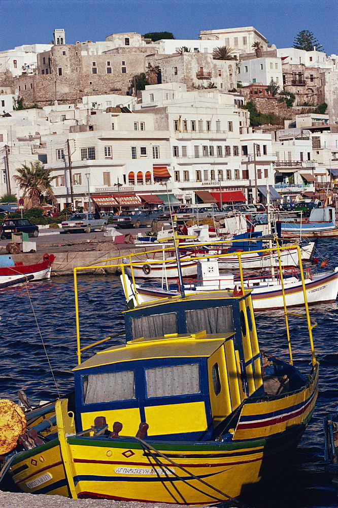 Fishing boats in the harbour with town in the background on the island of Naxos, Cyclades Islands, Greek Islands, Greece, Europe