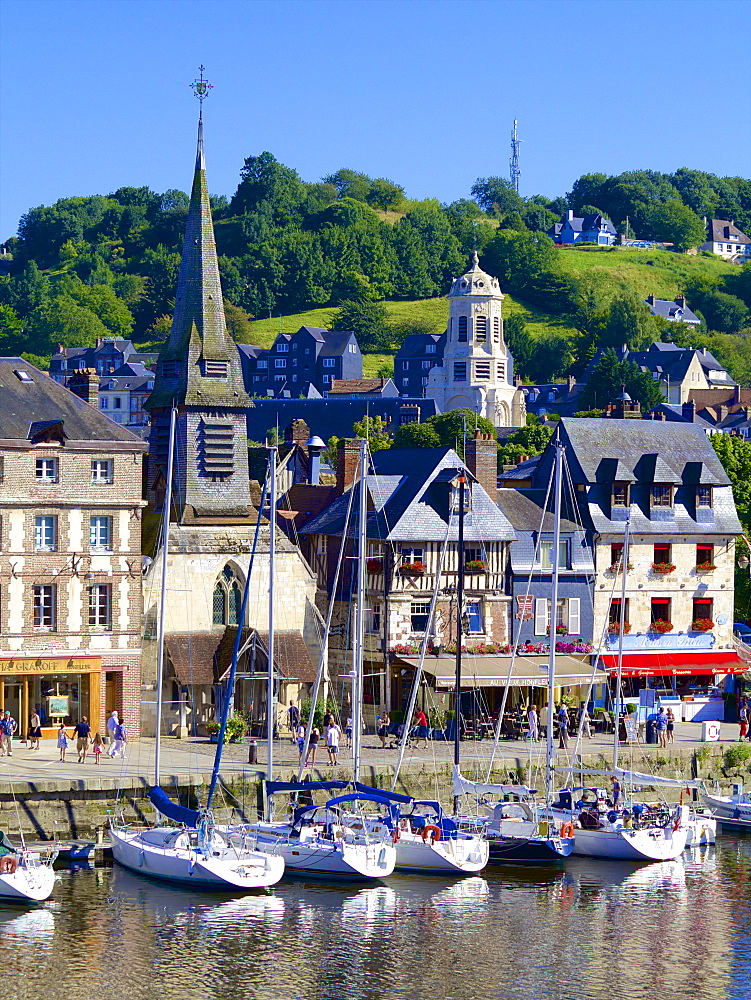 The Old Dock with pleasure boats moored, and St. Etienne Quay and church in the background, Honfleur, Auge, Normandy, France, Europe