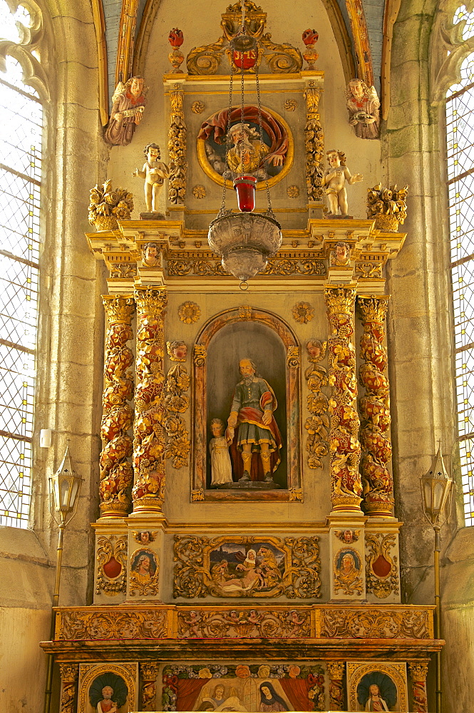 Altar with St. Peter and child inside St. Thegonnec church dating from the 16th and 17th centuries, St. Thegonnec, enclosure, Finistere, Brittany, France, Europe