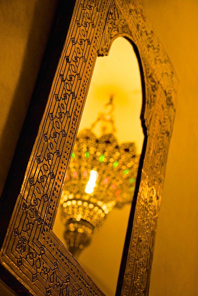 Brass ceiling lamp, reflected in typical mirror, Marrakech, Morocco, North Africa, Africa