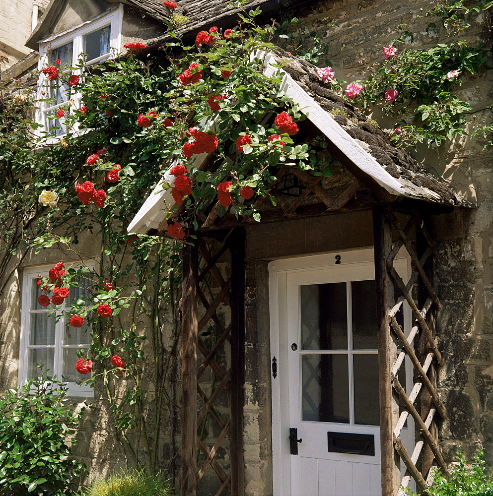 Roses round the door, Vineyard Street, Winchcombe, Gloucestershire, England, United Kingdom, Europe