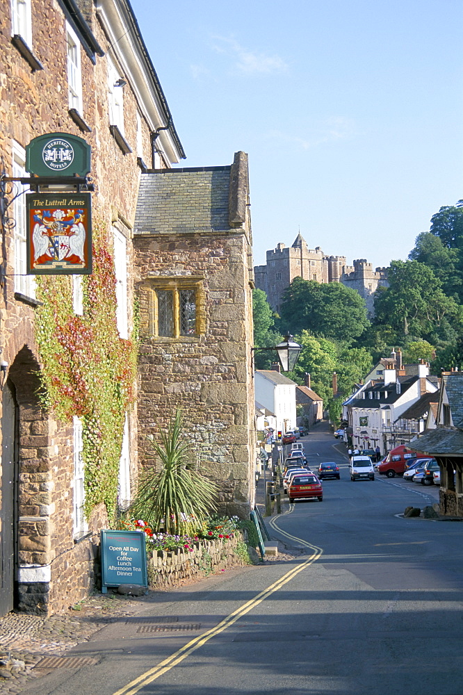 Luttrell Arms Hotel and Dunster Castle beyond, Dunster, Somerset, England, United Kingdom, Europe