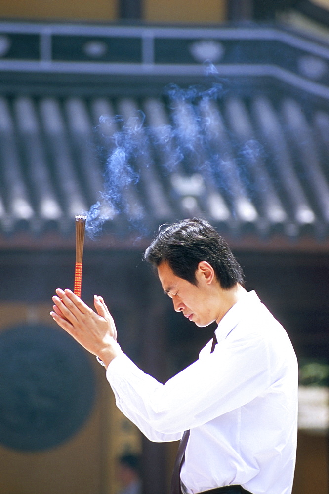 Man praying, Shanghai, China, Asia