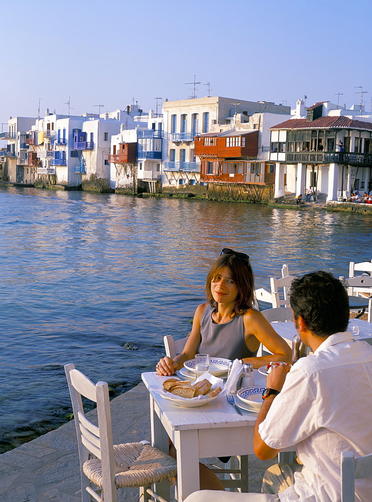 Couple eating at a restaurant, Little Venice, Mykonos Town, Mykonos (Mikonos), Cyclades Islands, Greek Islands, Greece, Europe