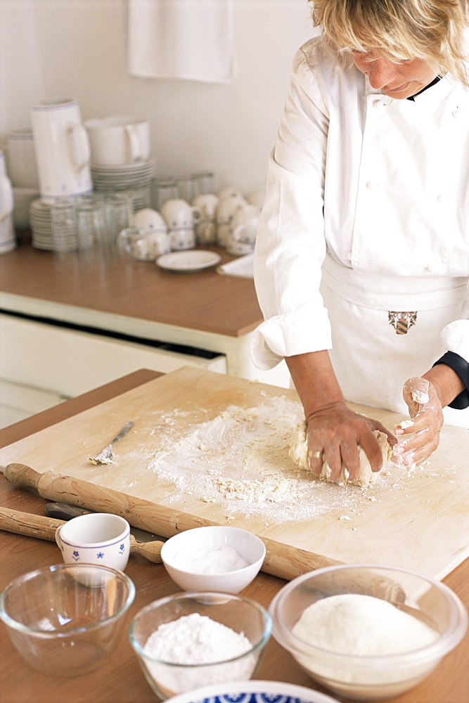 Kneading flour for pasta making in the kitchen, Arezzo, Tuscany, Italy, Europe