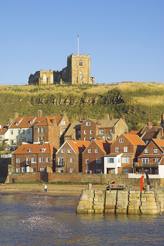 Church, sandy beach and harbour, Whitby, North Yorkshire, Yorkshire, England, United Kingdom, Europe