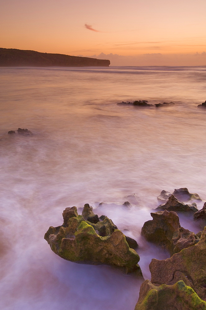 Sunset over blurred milky water, Amoreira beach near Alzejur, Algarve, Portugal, Europe