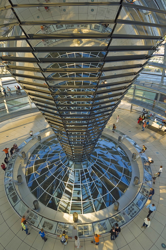 The cone shaped funnel in the dome cupola has 360 glass mirrors reflecting light into the Plenary chamber of the Reichstag building, designed by Sir Norman Foster, Berlin, Germany, Europe