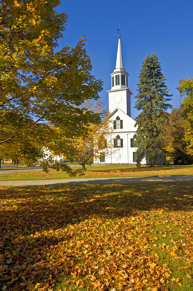 Autumn fall colours around traditional white timber clapperboard church, Townshend, Vermont, New England, United States of America, North America