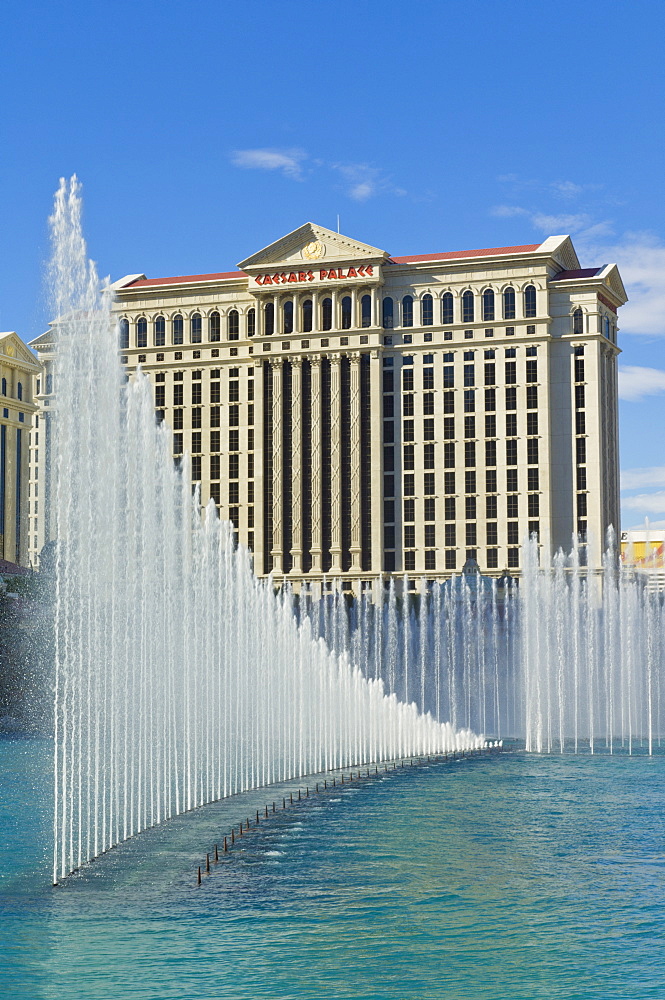 Lake Bellagio and the dancing water fountains, with the side  of Caesar's Palace Hotel, The Strip, Las Vegas Boulevard South, Las Vegas, Nevada, United States of America, North America