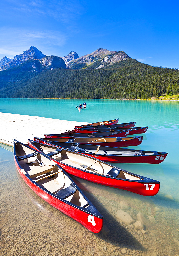 Red canoes for hire on Lake Louise, Banff National Park, UNESCO World Heritage Site, Alberta, The Rockies, Canada, North America