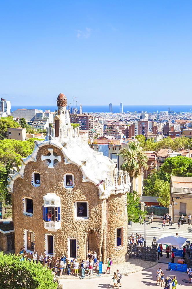 Casa del Guarda lodge by Antoni Gaudi at Parc Guell, UNESCO World Heritage Site, with a skyline view of the city of Barcelona, Catalonia (Catalunya), Spain, Europe