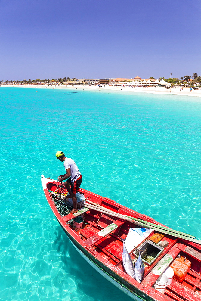 Fisherman with his catch of fish in a traditional fishing boat, Santa Maria, Sal Island, Cape Verde, Atlantic, Africa