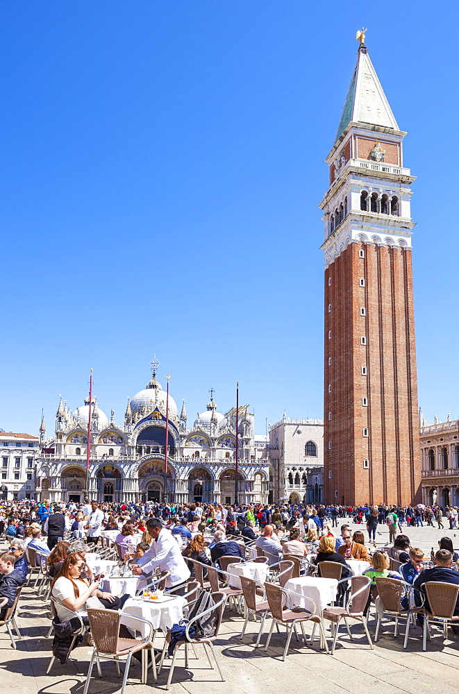 Campanile, Basilica di San Marco, Piazza San Marco, tourists and the cafes of St. Marks Square, Venice, UNESCO World Heritage Site, Veneto, Italy, Europe