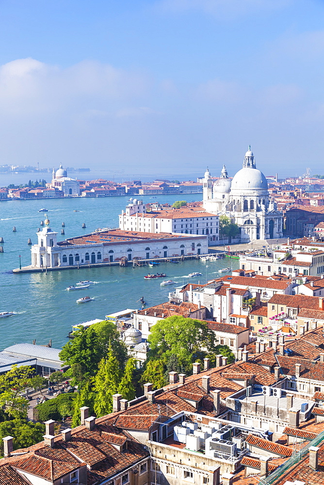 Vaporettos (water taxis), rooftops and the church of Santa Maria della Salute, on the Grand Canal, UNESCO World Heritage Site, Venice, Veneto, Italy, Europe