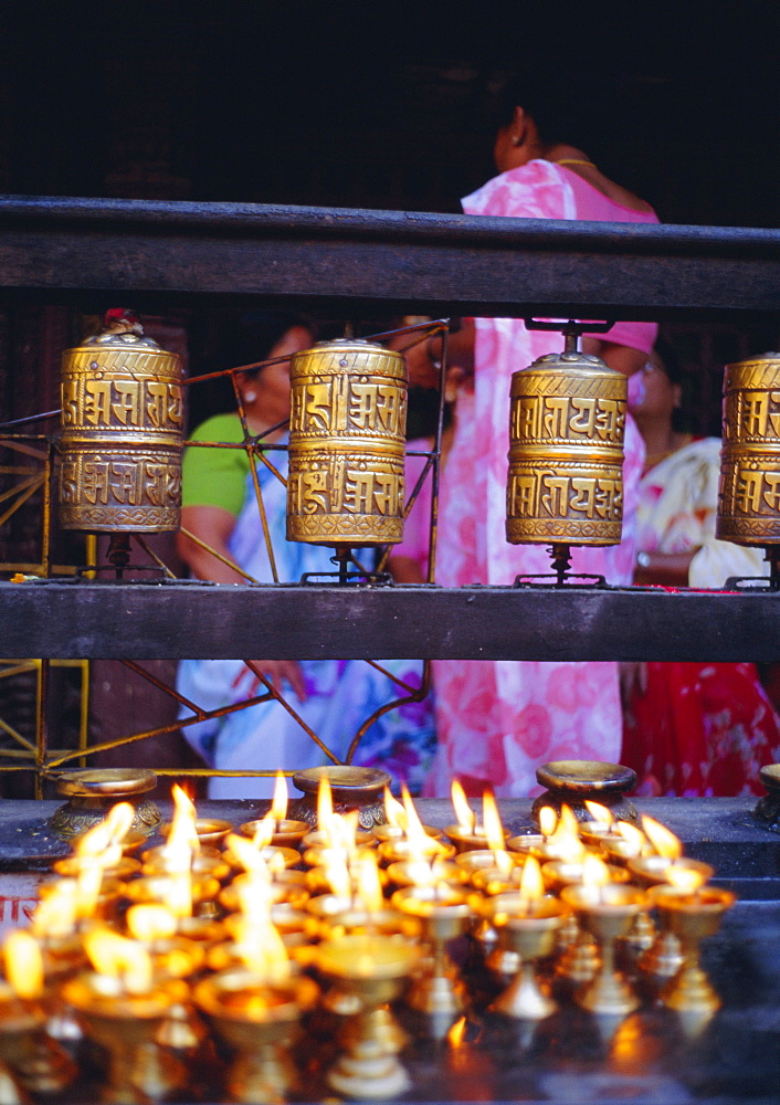 Lamps and prayer wheels, Gold Temple, Patan, Kathmandu Valley, Nepal, Asia