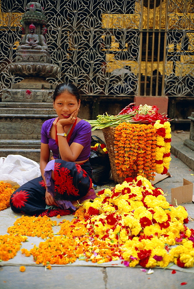 Woman selling flowers, Asan Tole Buddhist temple, Kathmandu, Kathmandu Valley, Nepal, Asia