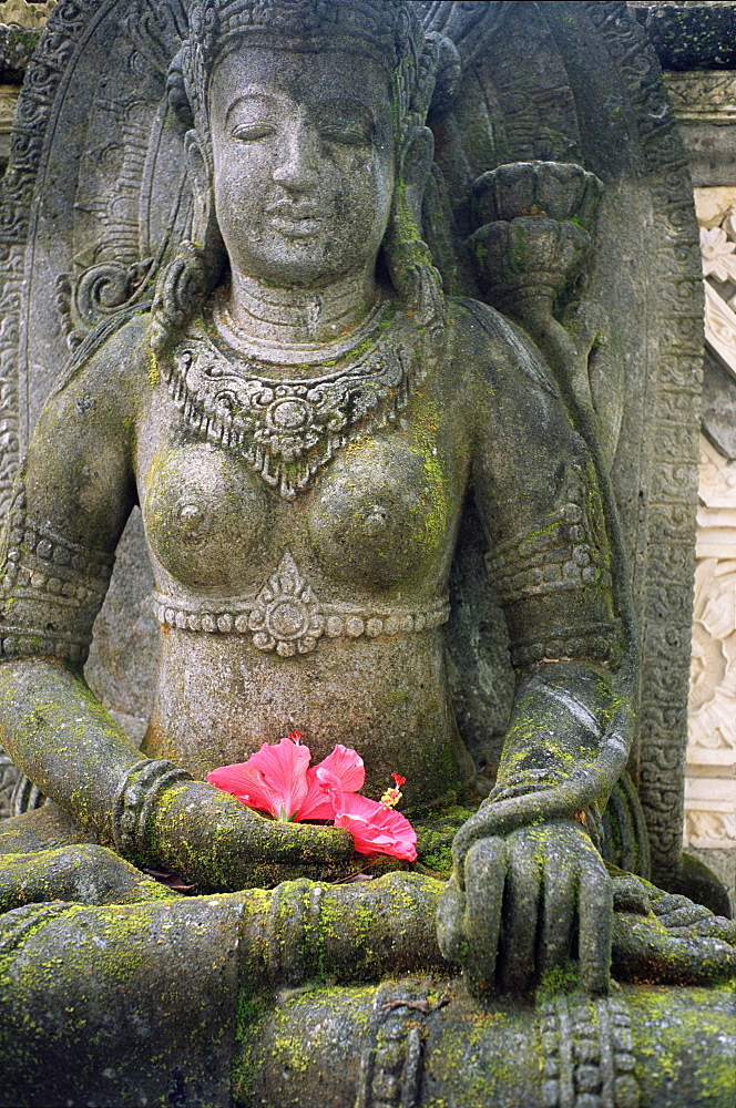 Statue with flower offering, Odalan, ceremony, at Bataun temple, Bali, Indonesia, Asia