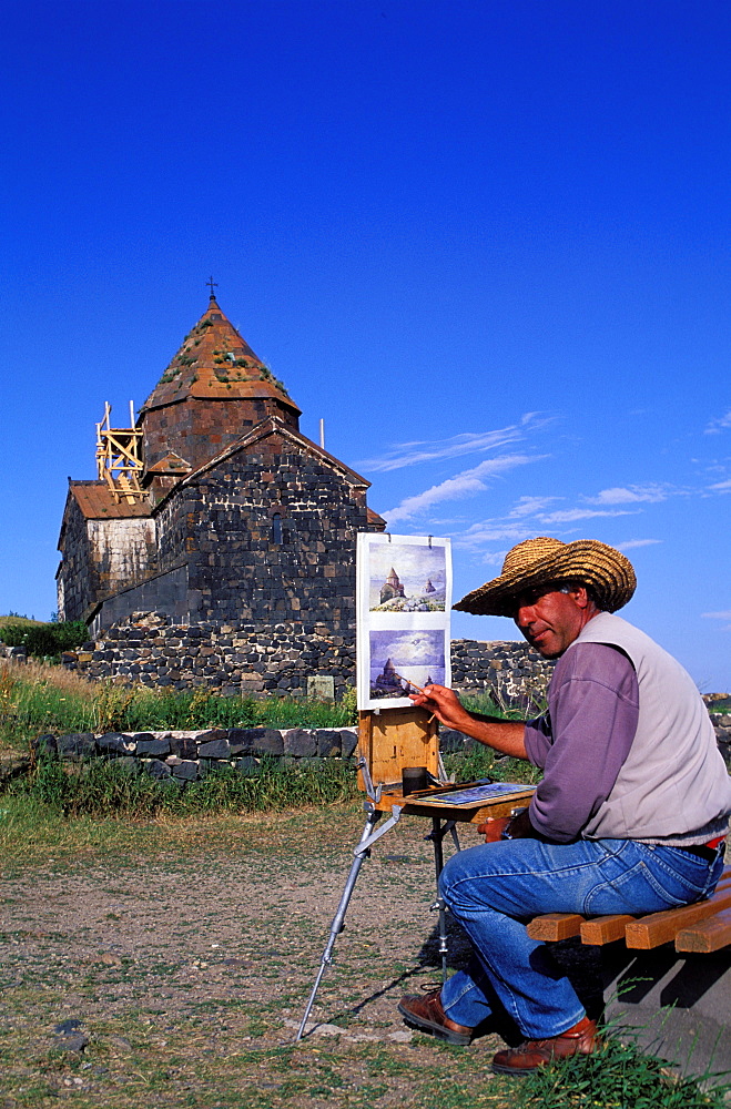 Painter, Lake Sevan church, Armenia, Asia