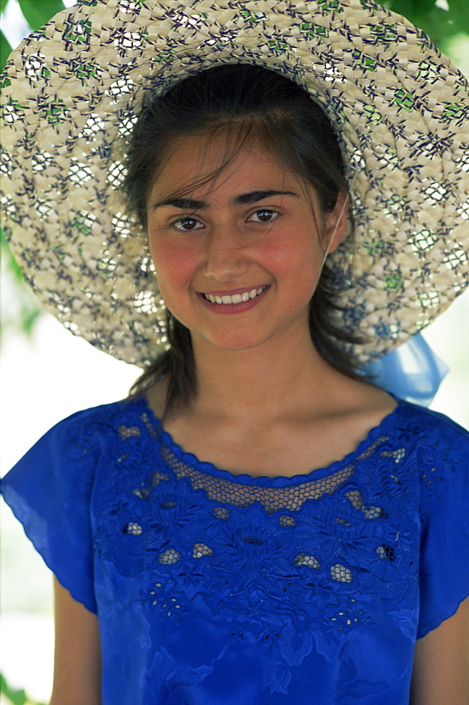 Portrait of an Armenian girl in blue dress and straw hat, Armenia, Central Asia, Asia