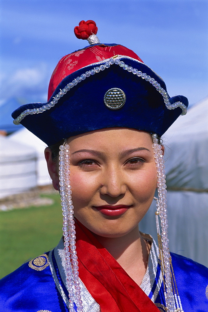 Head and shoulders portrait of a young woman dancer in traditional clothing at Naadam Festival, Altai, Gov-altai, Mongolia, Central Asia, Asia