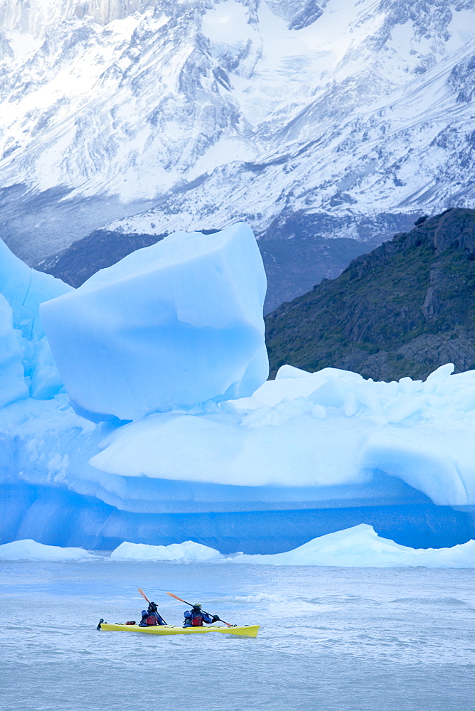 Person kayaking near floating icebergs, Lago Gray (Lake Gray), Torres del Paine National Park, Patagonian Andes, Patagonia, Chile, South America