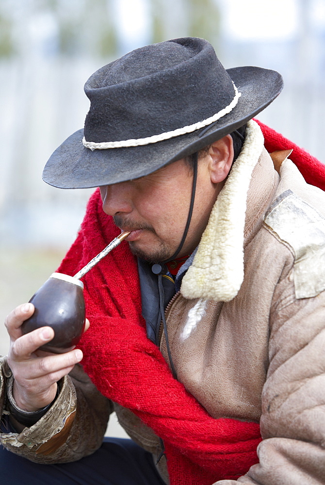 A gaucho drinking mate tea, Torres del Paine National Park, Patagonia, Chile, South America