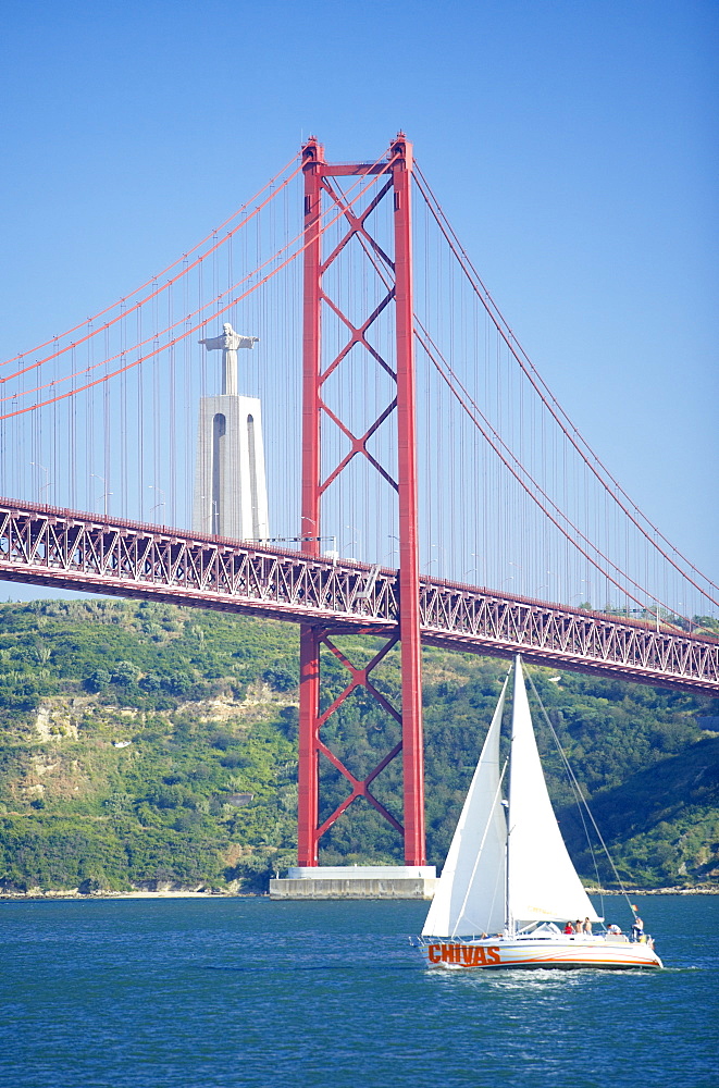 25th April bridge over the Tagus river and the Christ Statue in background, a gift from Brazil, this smaller replica represents the lasting friendship of the former colony), Lisbon, Portugal, Europe