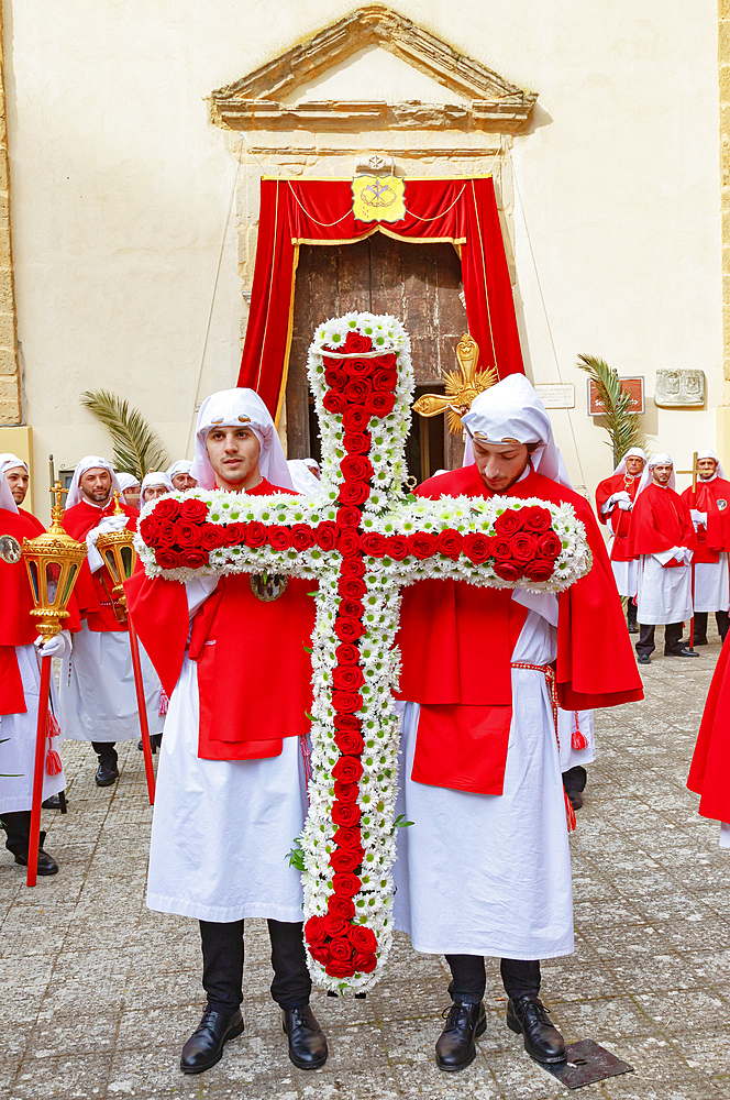 Penitents holding cross made with flowers, Enna, Sicily, Italy, Mediterranean, Europe