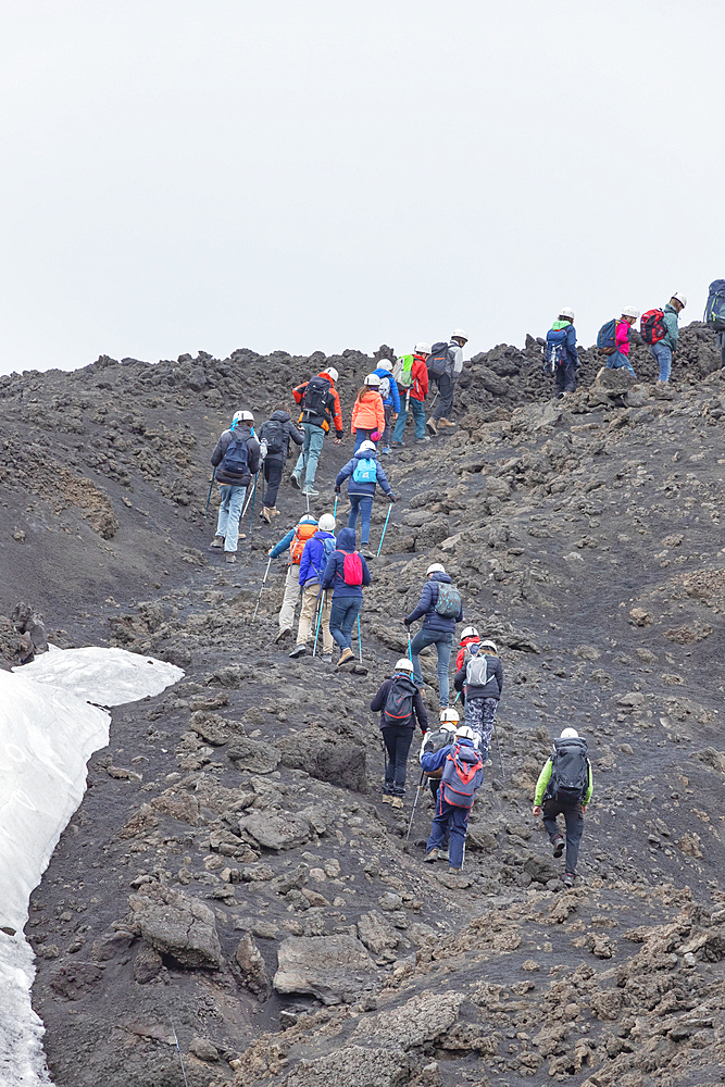 Group of hikers walking up to Mount Etna summit, UNESCO World Heritage Site, Etna, Sicily, Italy, Mediterranean, Europe