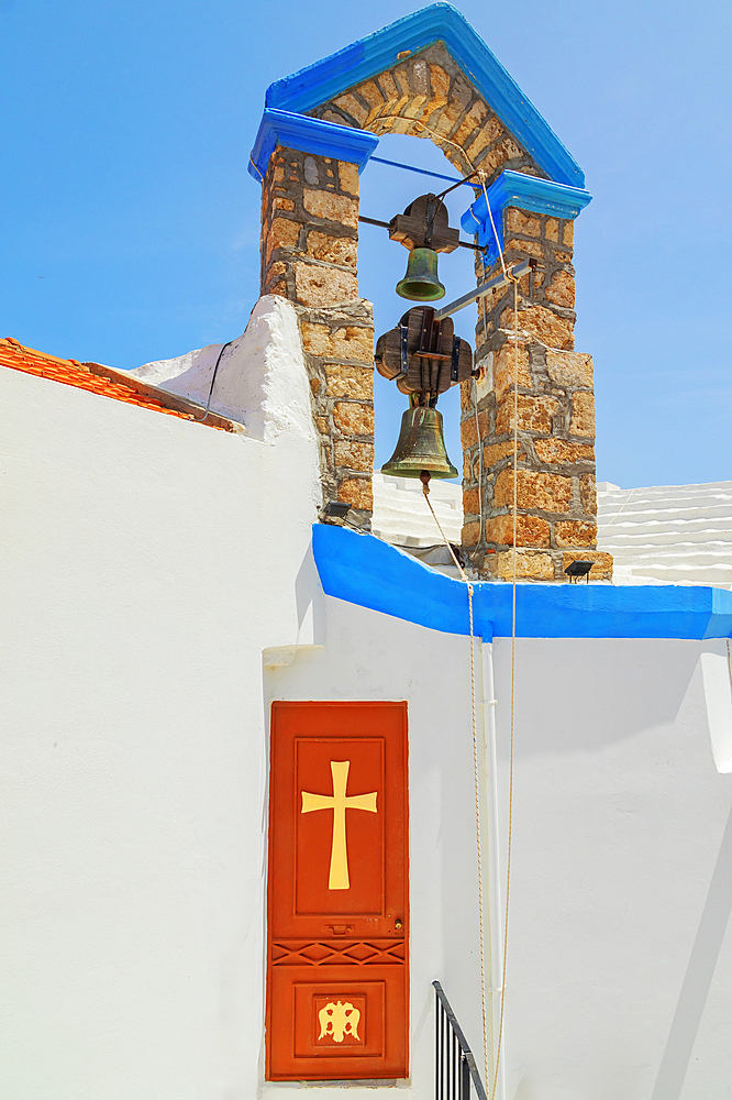 Door and bell tower of Megali Panagia church, Chorio, Symi Island, Dodecanese Islands, Greece