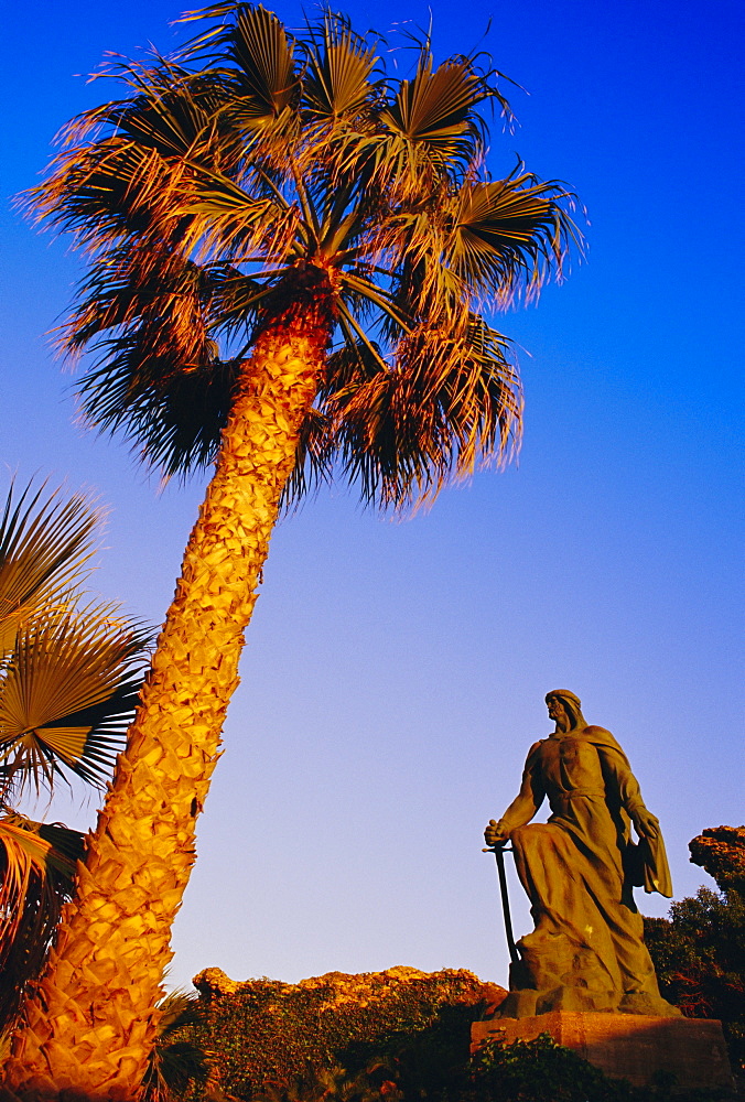 Abdar Rahman I statue and palm tree, Almunecar, Andalusia, Spain