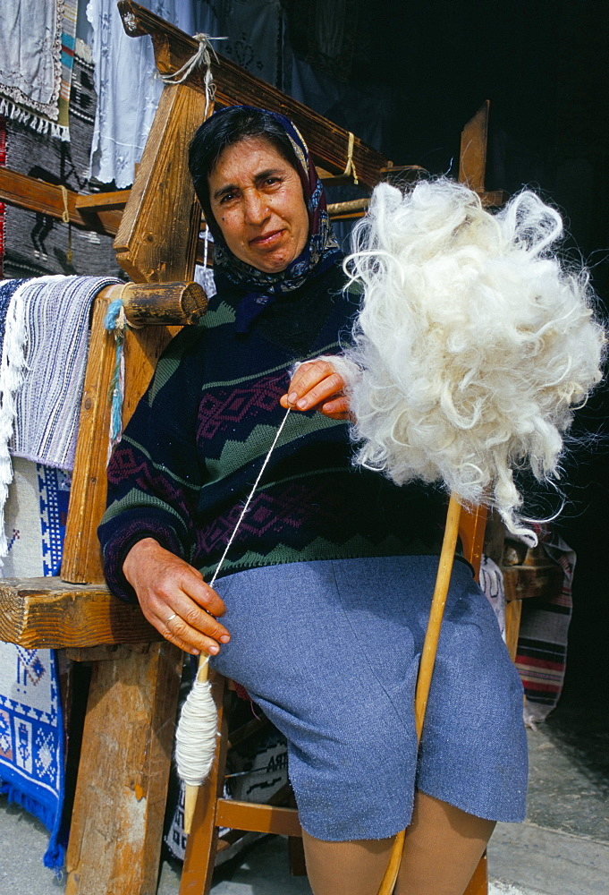 Local weaver spinning wool, Lassithi Plateau, island of Crete, Greece, Mediterranean, Europe