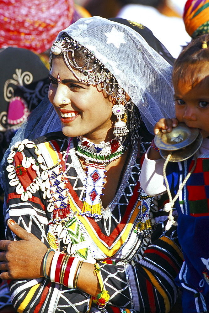 Rajasthani girl adorned with jewellery, Bikaner Desert Festival, Rajasthan state, India, Asia