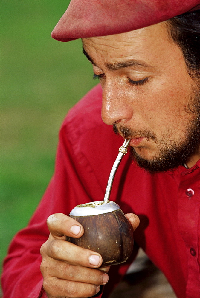 A gaucho drinking mate, Torres del Paine National Park, Patagonia, Chile, South America