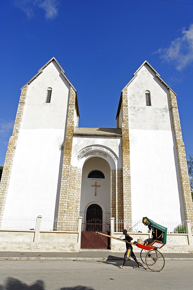 Rickshaw passing Lutheran Church, Toliara (Tulear), capital of the Atsimo-Andrefana region, Madagascar, Africa 